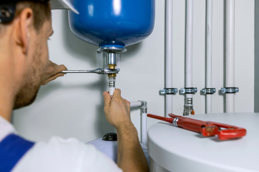 Roanoke plumber installing a water heater