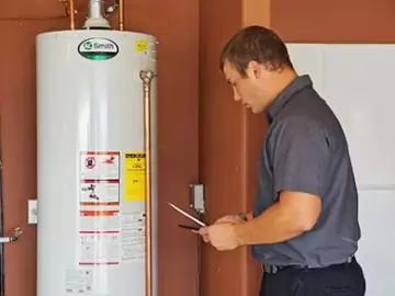 Masters installing water heater