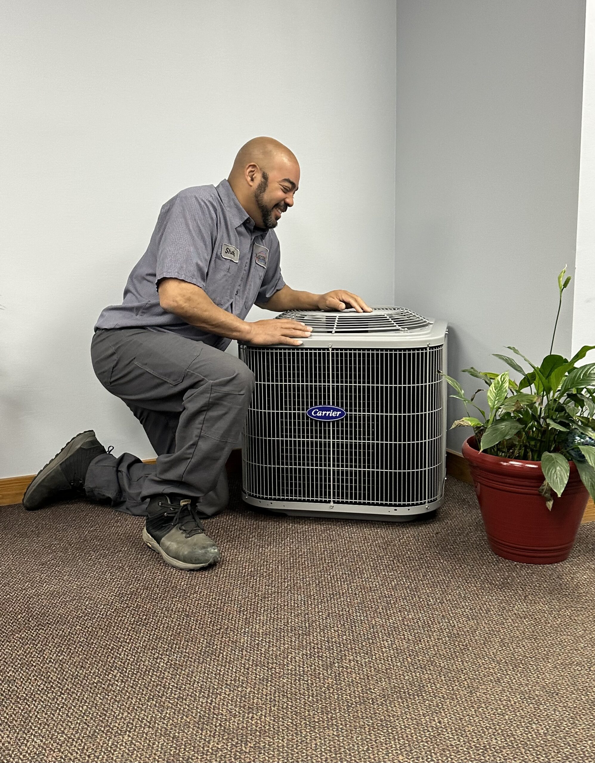 HVAC technician working on a commercial cooling unit