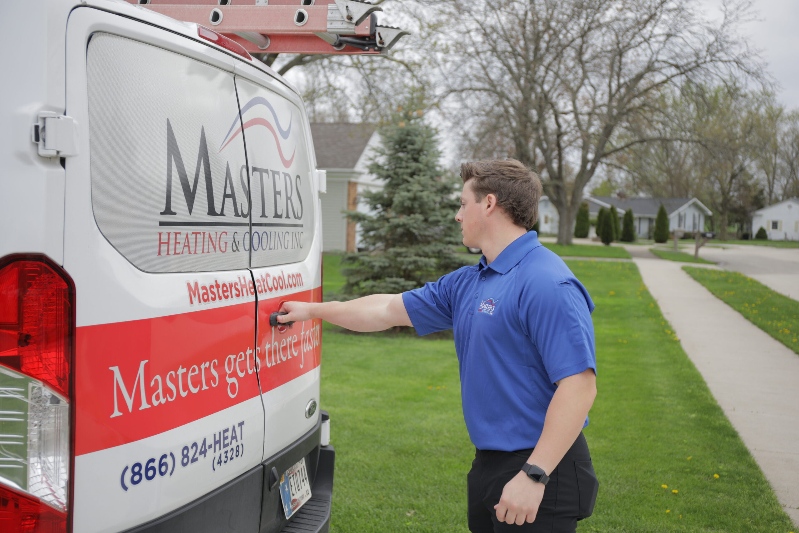 HVAC technician performing a repair service on a residential furnace